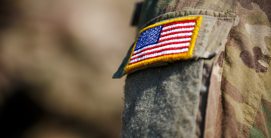 Close-up of an American flag patch on a soldier