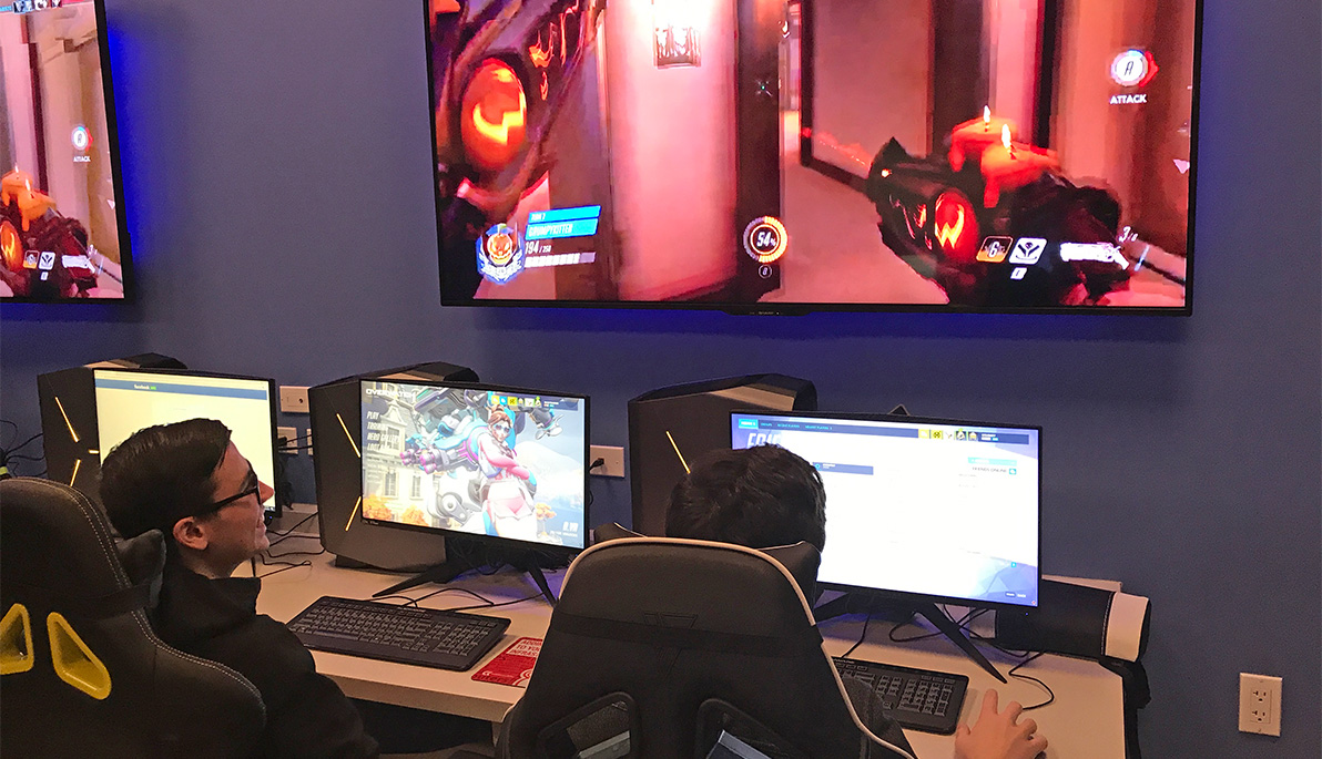NYIT students playing video games in the eSports arena.