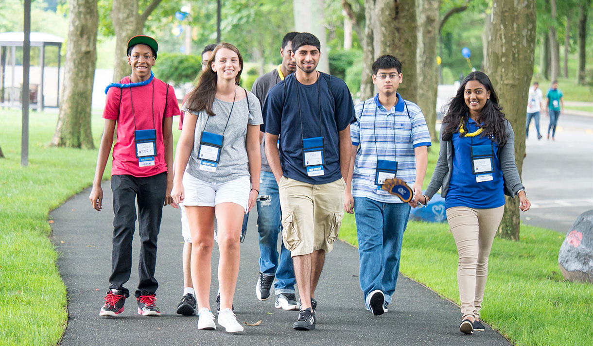 students walking along campus path