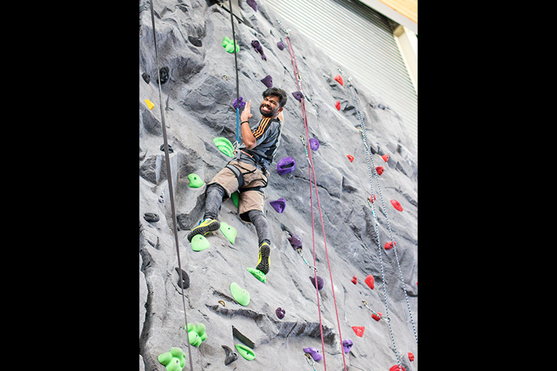 Reaching new heights on the indoor climbing wall.