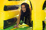 Finding her way through an obstacle course at MayFest.