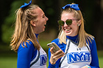 NYIT cheerleaders wait in line to play lawn games.