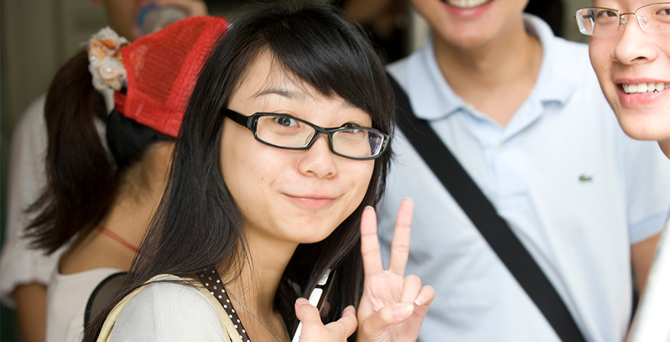 Chinese student giving peace sign