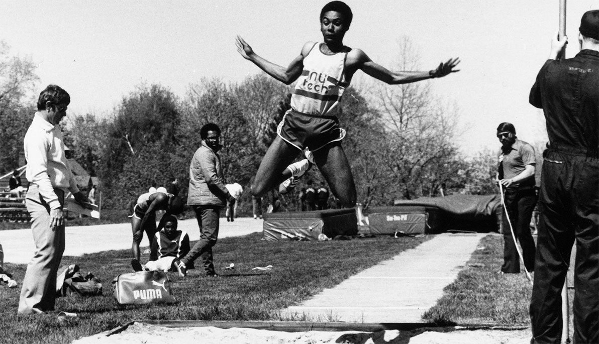 NYIT student-athlete competing in the long jump.