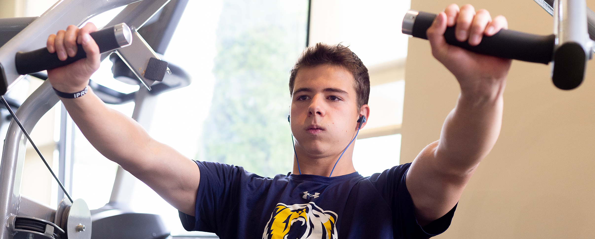 Student athlete using exercise equipment
