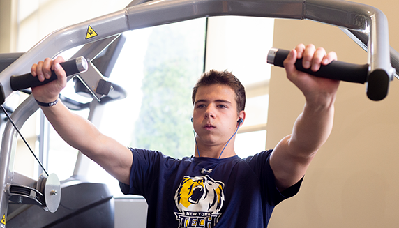 Student athlete using exercise equipment