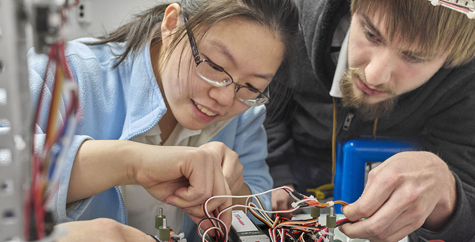 High school students working on a maker project