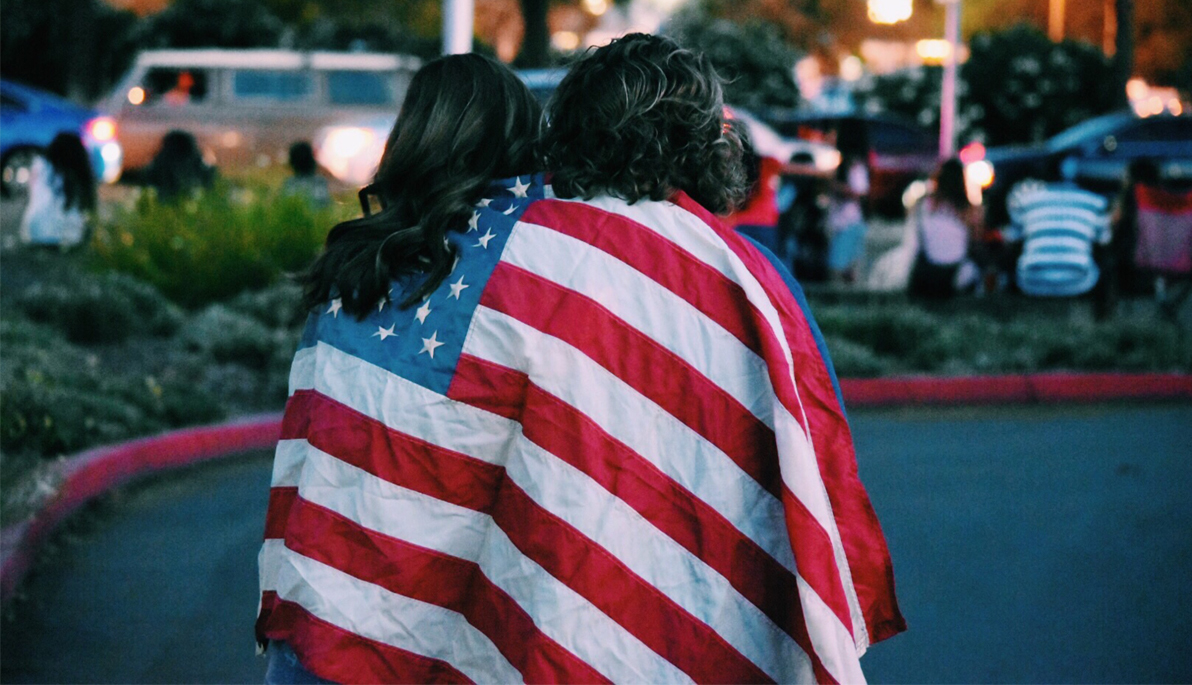 Two women wearing the American flag
