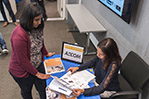 A student meets with a recruiter from AECOM.