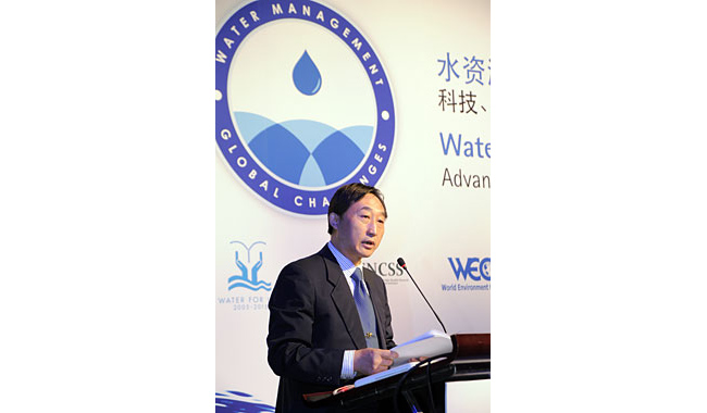 Ning Liu gives keynote address at conference.
