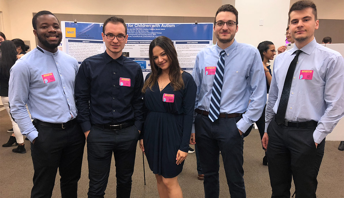 A group of five student researchers standing infront of their project board.