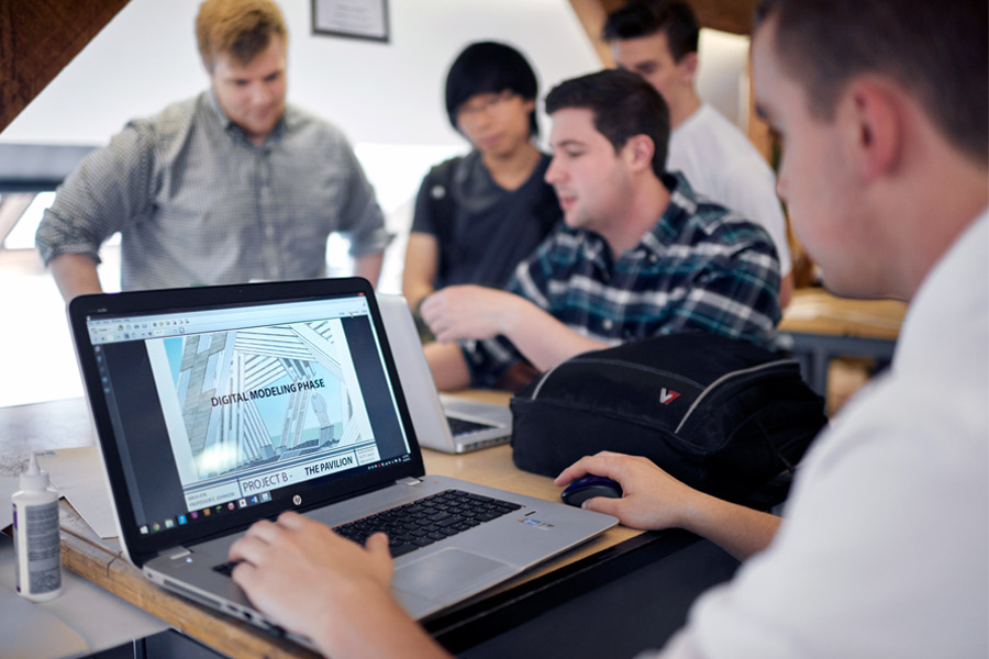 M.Arch. students at New York Tech use laptops to explore and master modeling software for building and construction projects.