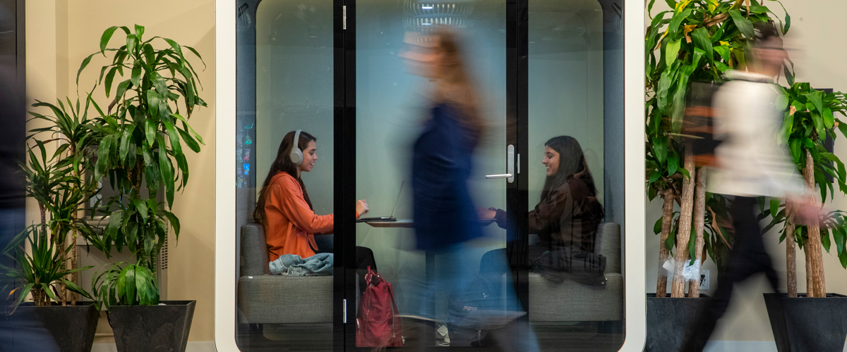 Students sitting in a study pod