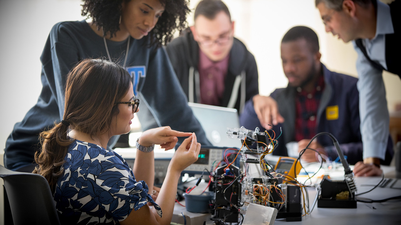 Electrical engineering students at a hands-on workshop