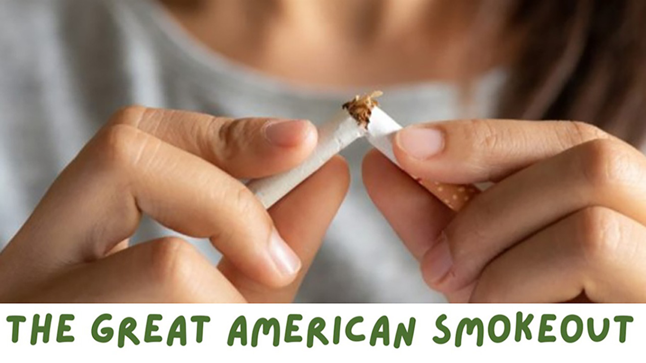 A person breaking a cigarette wih the words "Great American Smokeout"