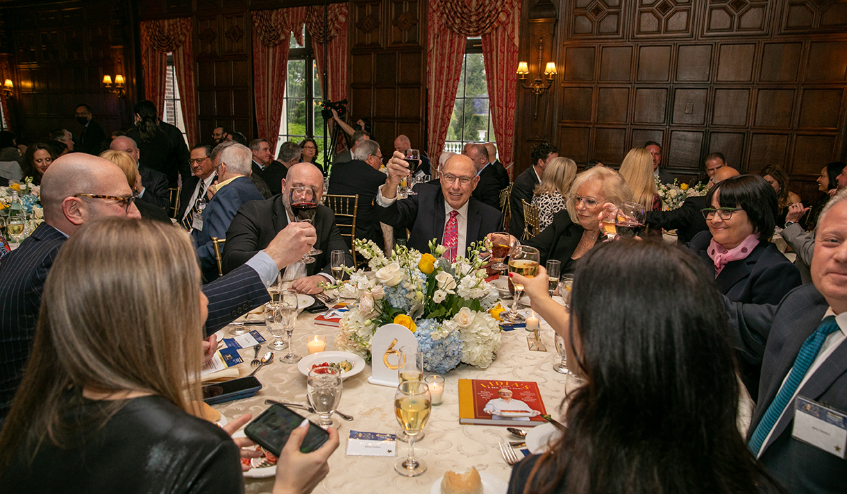 A gathering of alumni at a dinner