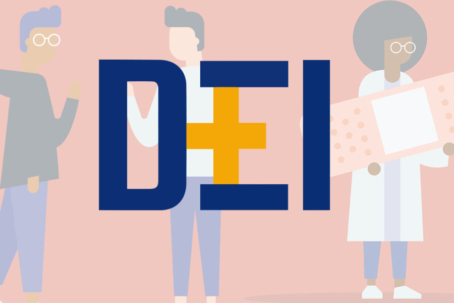 People standing near letters spelling DEI (logo)