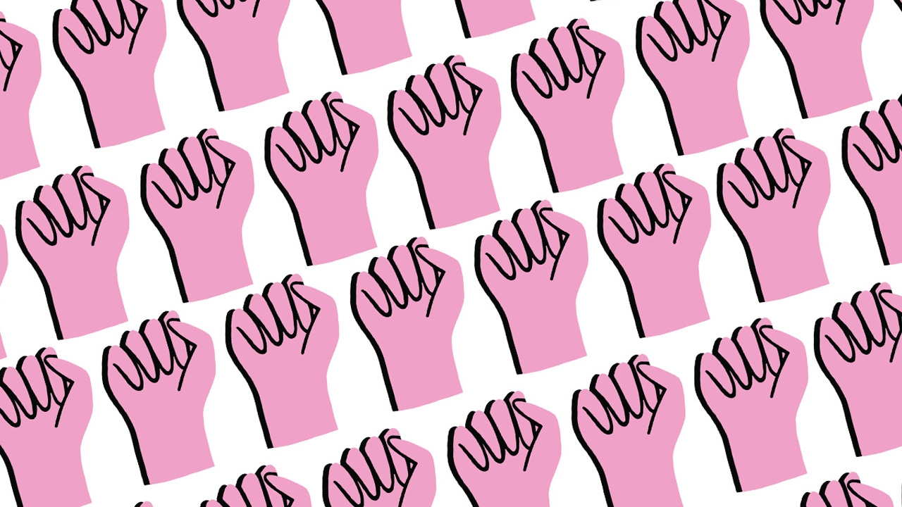 Pink fists raised up for women's rights