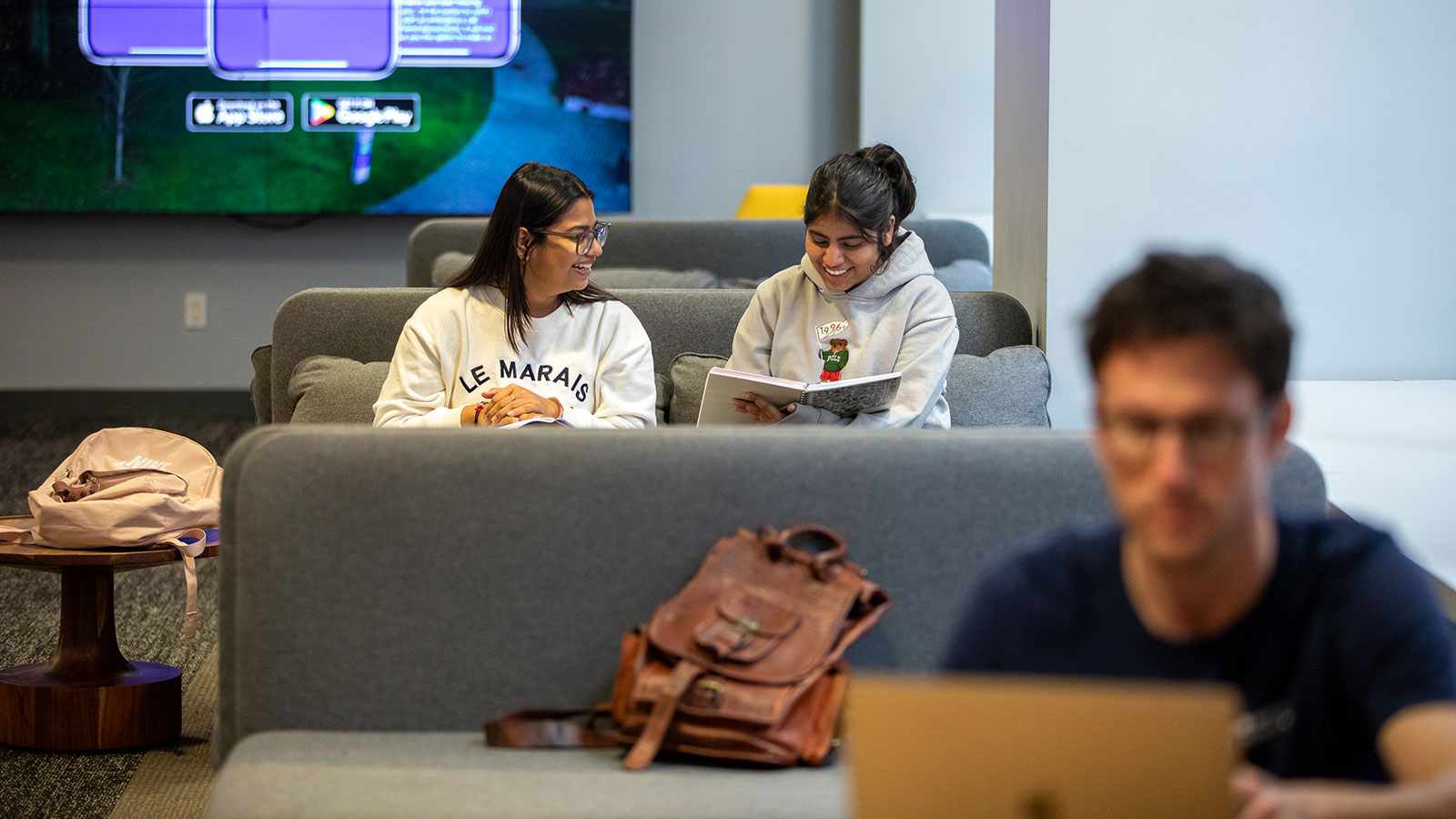 Students are studying in the lounge at the New York City campus.