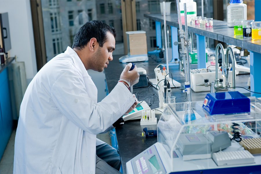 A student works in a science lab at the New York City campus.