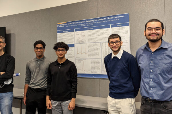 Five students standing in front of their project board.