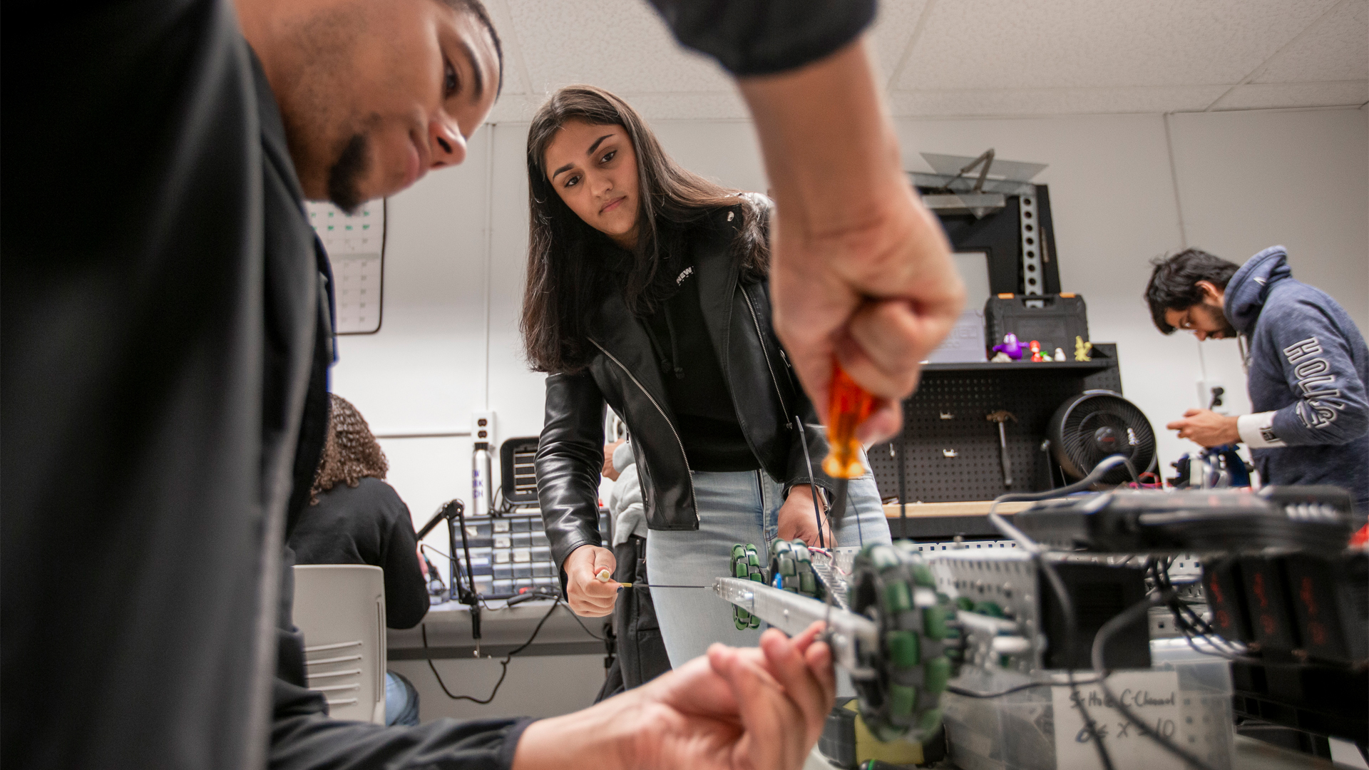 Student working on an project in a lab for electrical engineering.