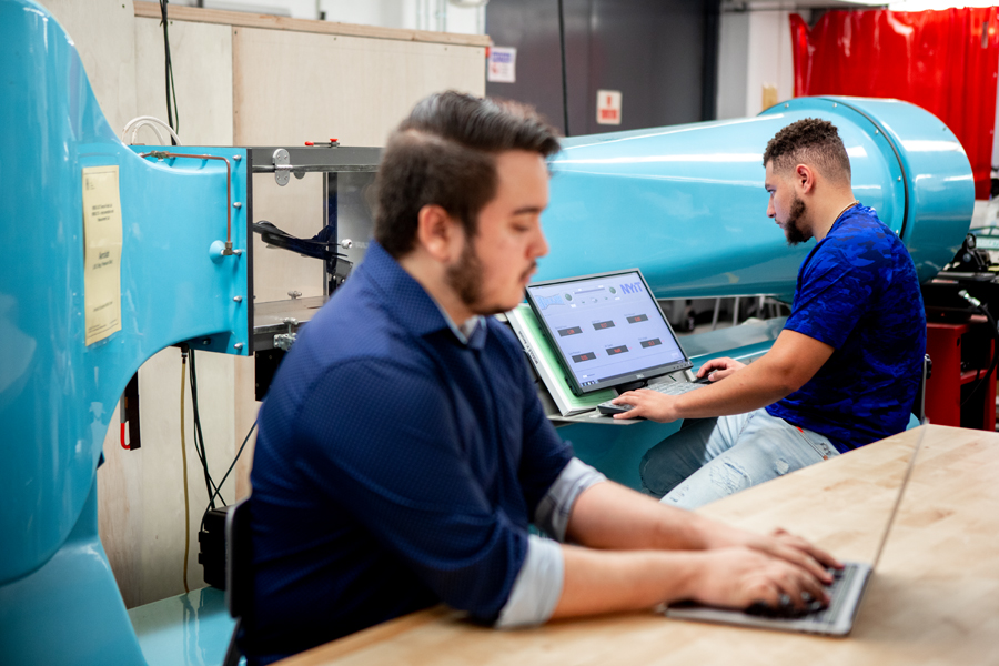 Two students work in the Materials Lab in the College of Engineering and Computing Sciences. 