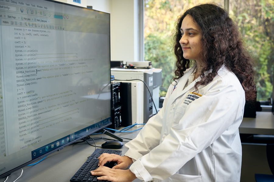 A College of Engineering and Computing Sciences NASA student works on the computer in the Entrepreneurship and Technology Innovation Center (ETIC).