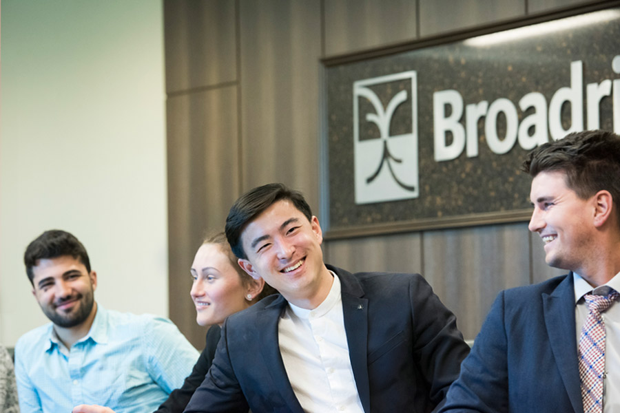 A group of people in a business conference room.