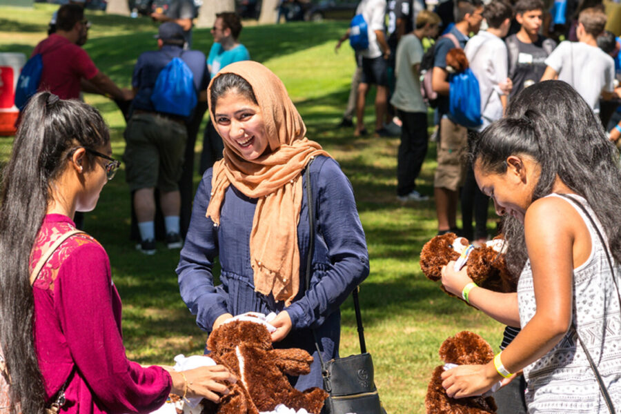 Group of students making plush toys.