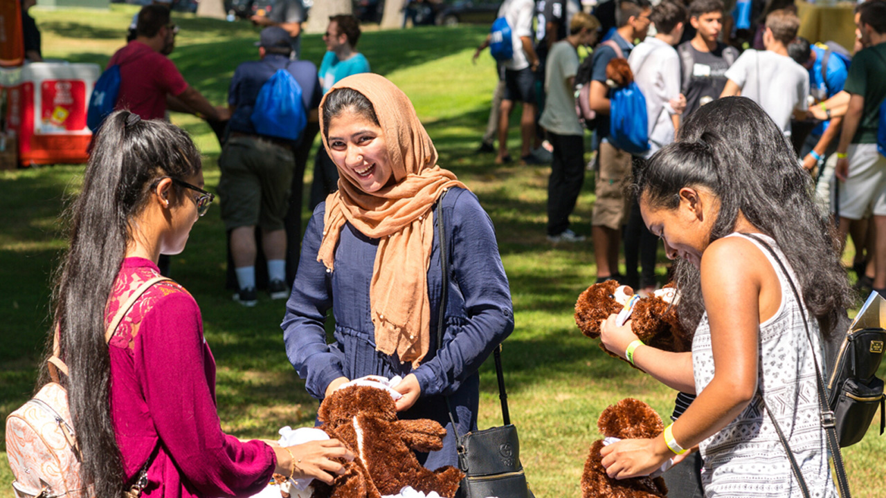 Group of students making plush toys.