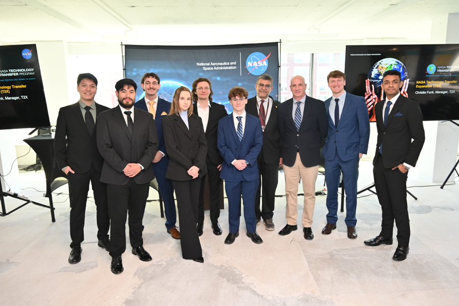 Group of New York Tech students and faculty