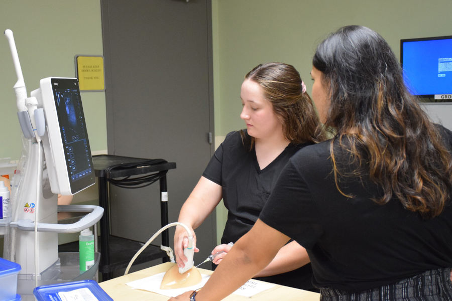 Elizabeth Duplechain performing a sonogram