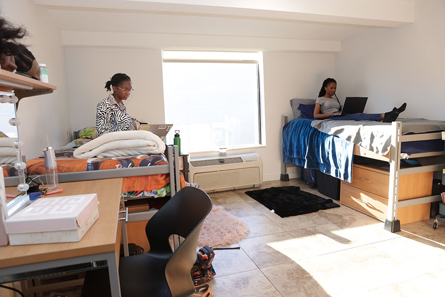 Two students study in their room at the Long Island Residence Hall.