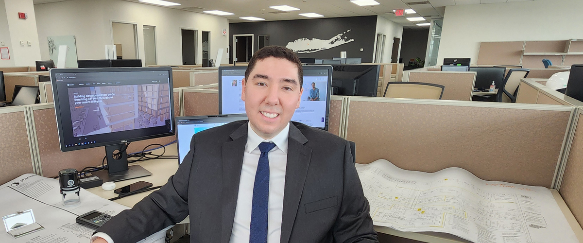 Khalid Hachil sitting at a desk