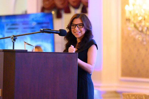 Roxana Kairiyannis at a podium