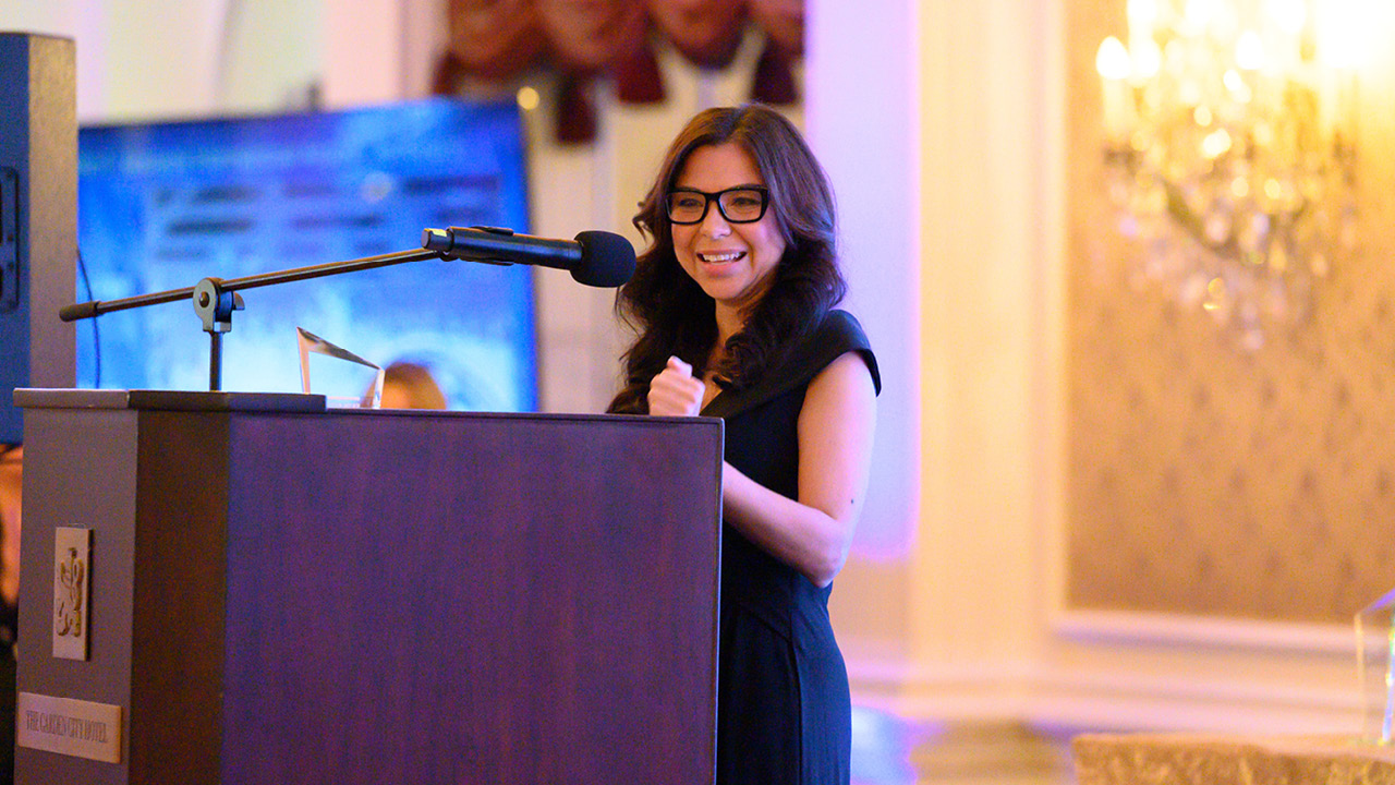 Roxana Kairiyannis at a podium