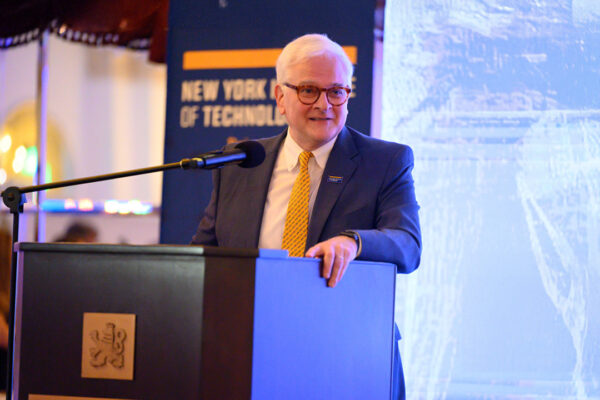 President Hank Foley at a podium