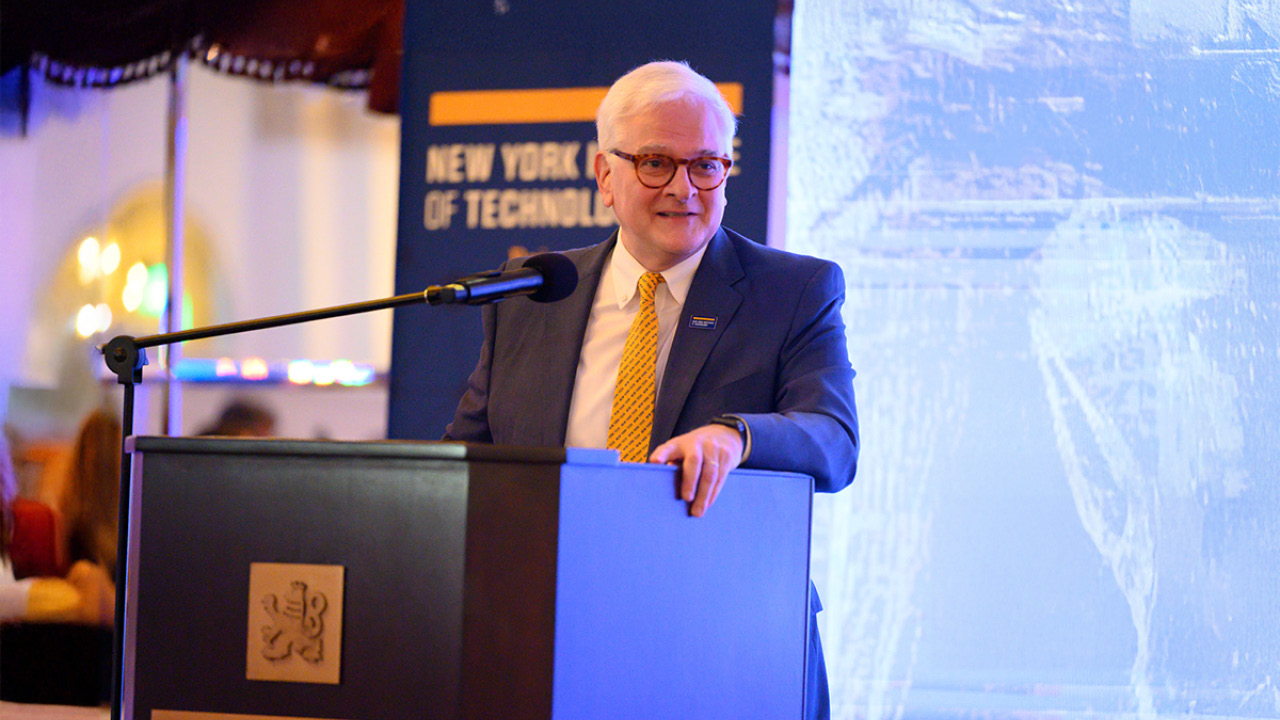 President Hank Foley at a podium