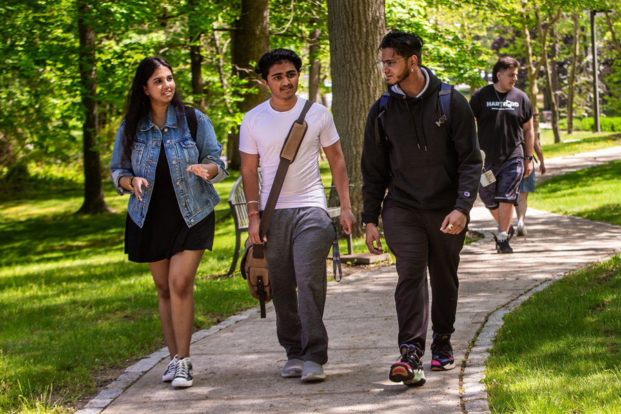 Three students walking on Long Island campus