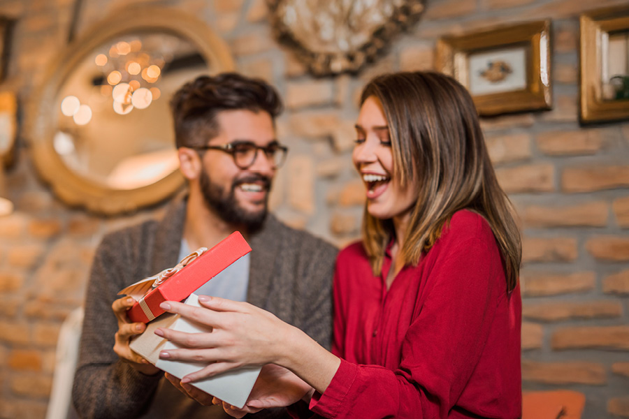 Man and woman exchanging gifts