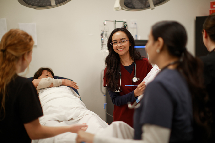 Nursing students in a medical simulation lab. 