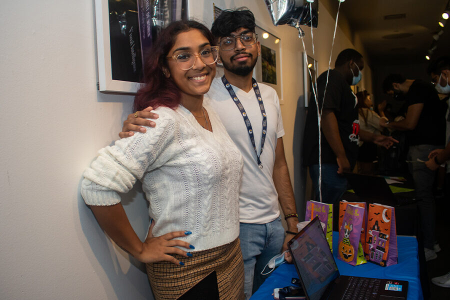 Two students at a booth.