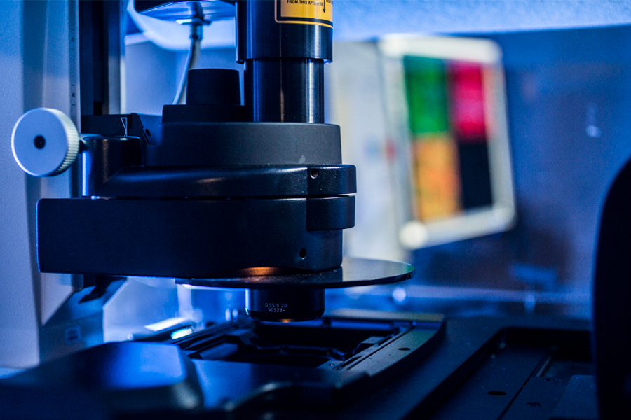 A close up of a microscope in a lab.