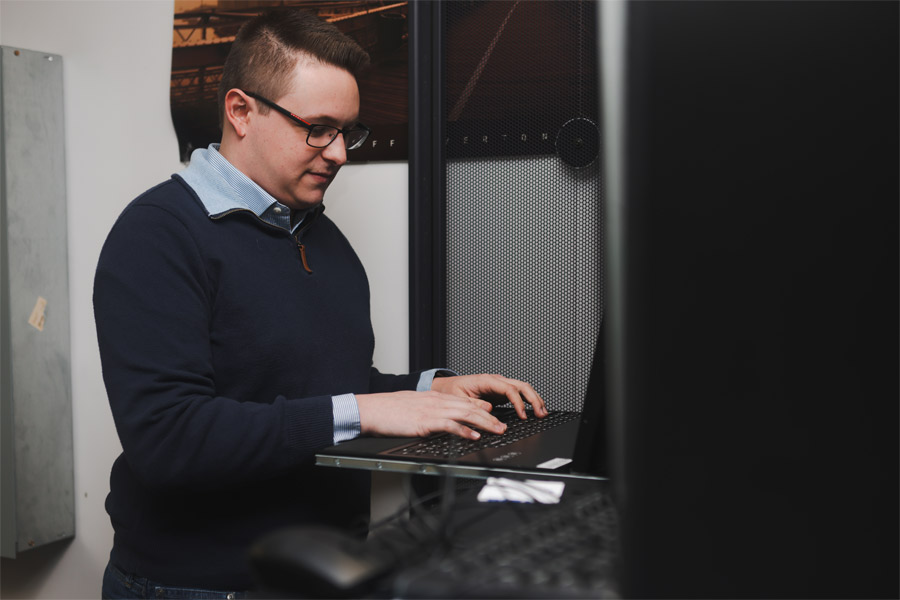 A person working in a data center.