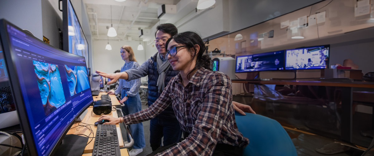 Student and Professor reviewing a project in The Hive